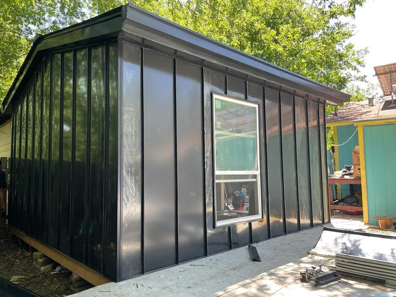 Black standing seam metal wall panels for Roof Inspection in Stow